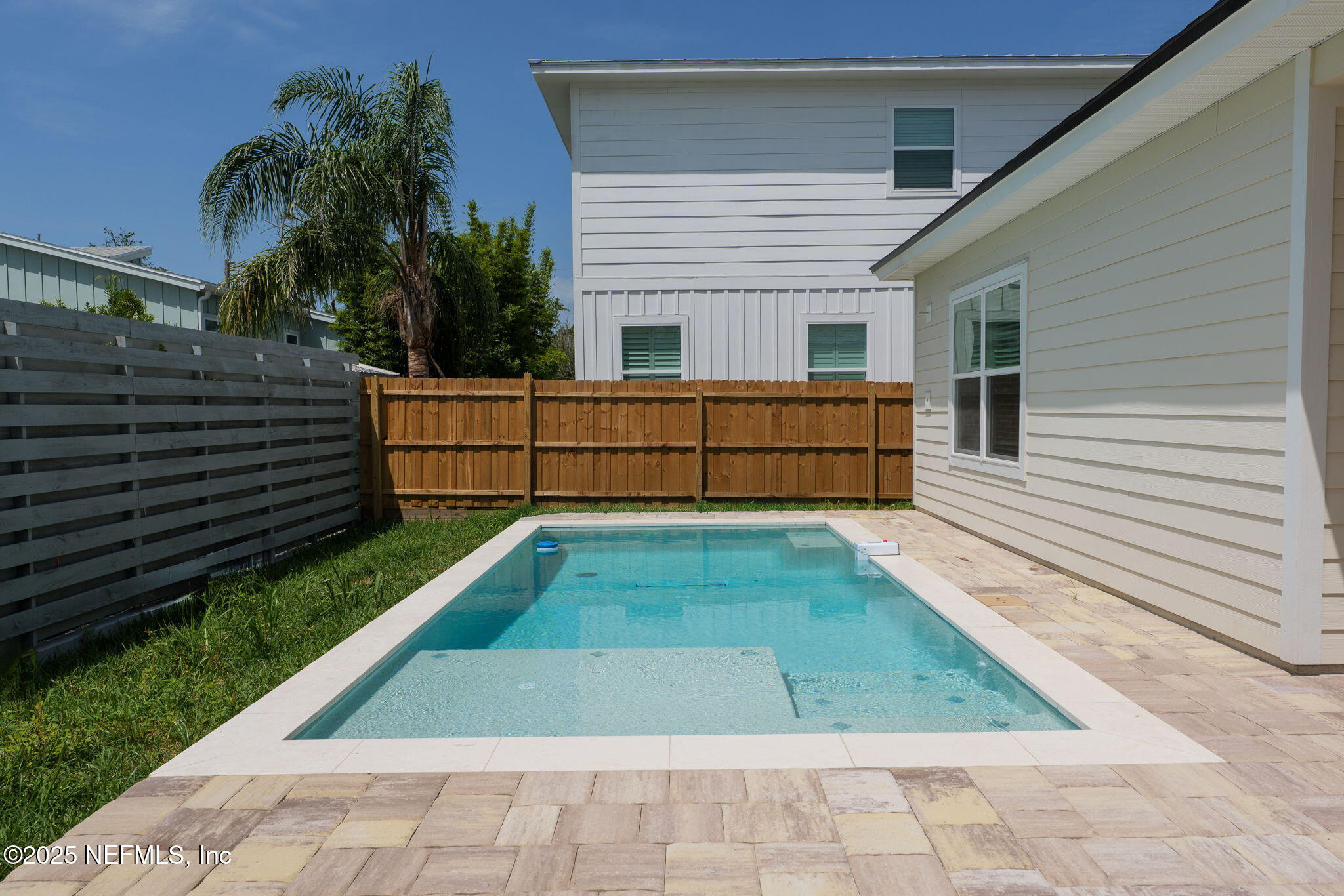 609 Twenty Second Street St. Augustine, FL 32084 - Photo 32 of 34 a front view of a house with a yard
