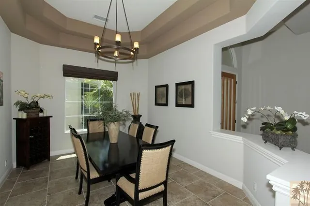 a dining room with furniture and window