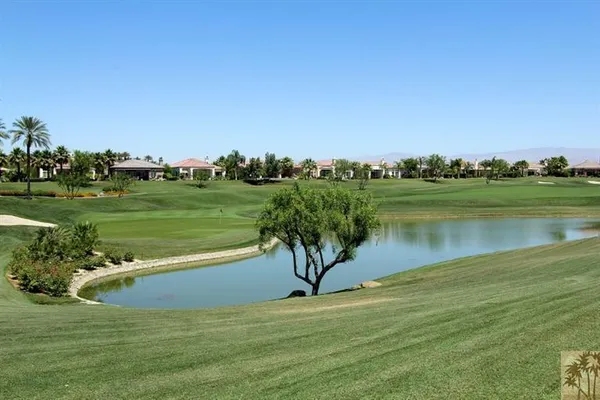 a view of a lake with a big yard