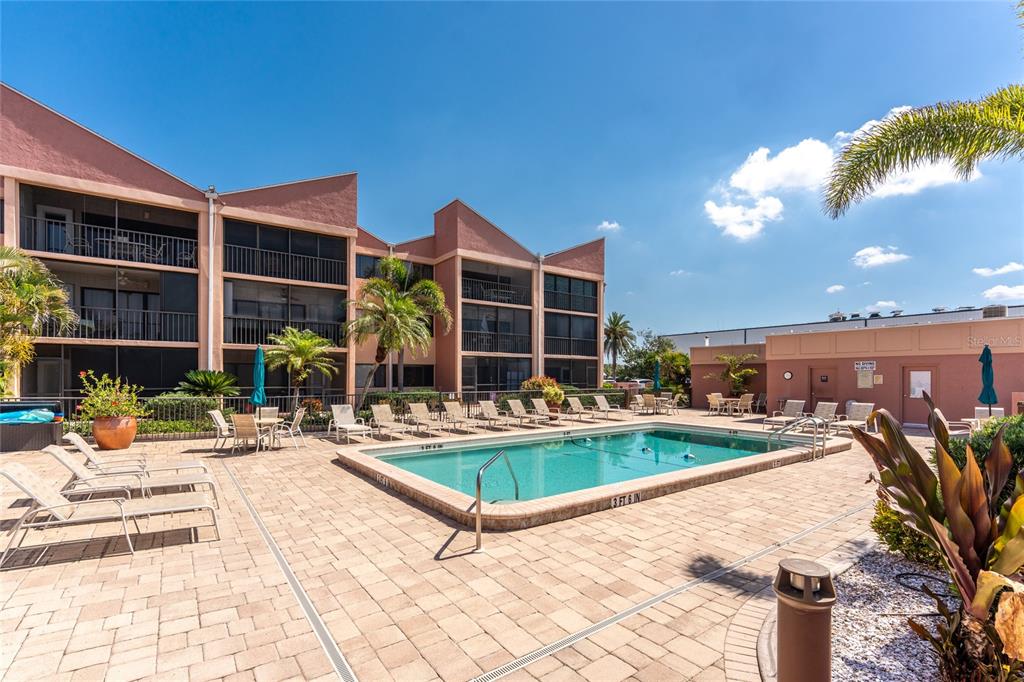 3160 Matecumbe Key Road, Unit 238 Punta Gorda, FL 33955 - Photo 23 of 41 a view of a house with swimming pool and sitting area