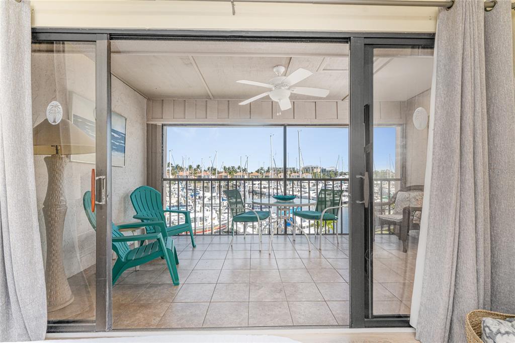 3160 Matecumbe Key Road, Unit 238 Punta Gorda, FL 33955 - Photo 4 of 41 a balcony with table and chairs
