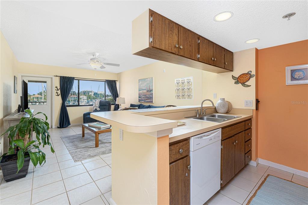 3160 Matecumbe Key Road, Unit 238 Punta Gorda, FL 33955 - Photo 8 of 41 a kitchen with a sink and cabinets