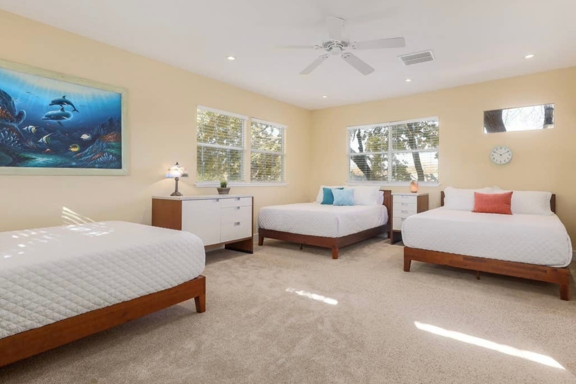 1159 Navasota Street Austin, TX 78702 - Photo 16 of 23 a spacious bedroom with two beds and a large window