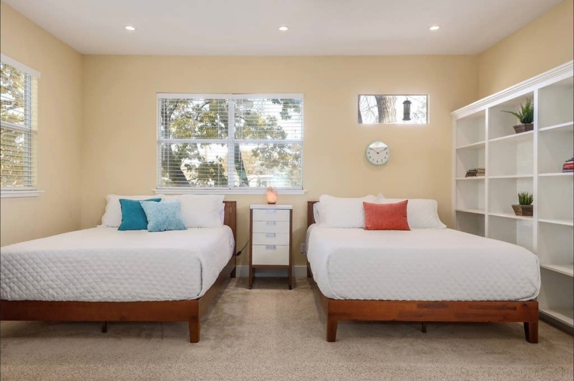 1159 Navasota Street Austin, TX 78702 - Photo 17 of 23 a bedroom with a large bed and a large window