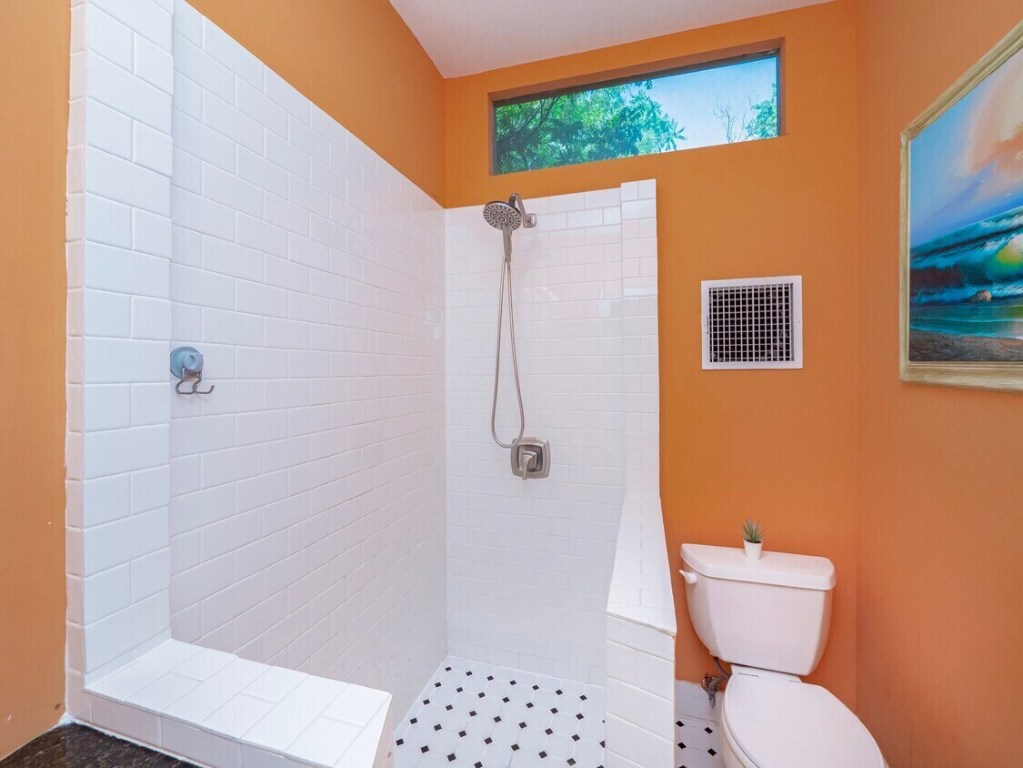 1159 Navasota Street Austin, TX 78702 - Photo 18 of 23 a bathroom with a toilet and a shower