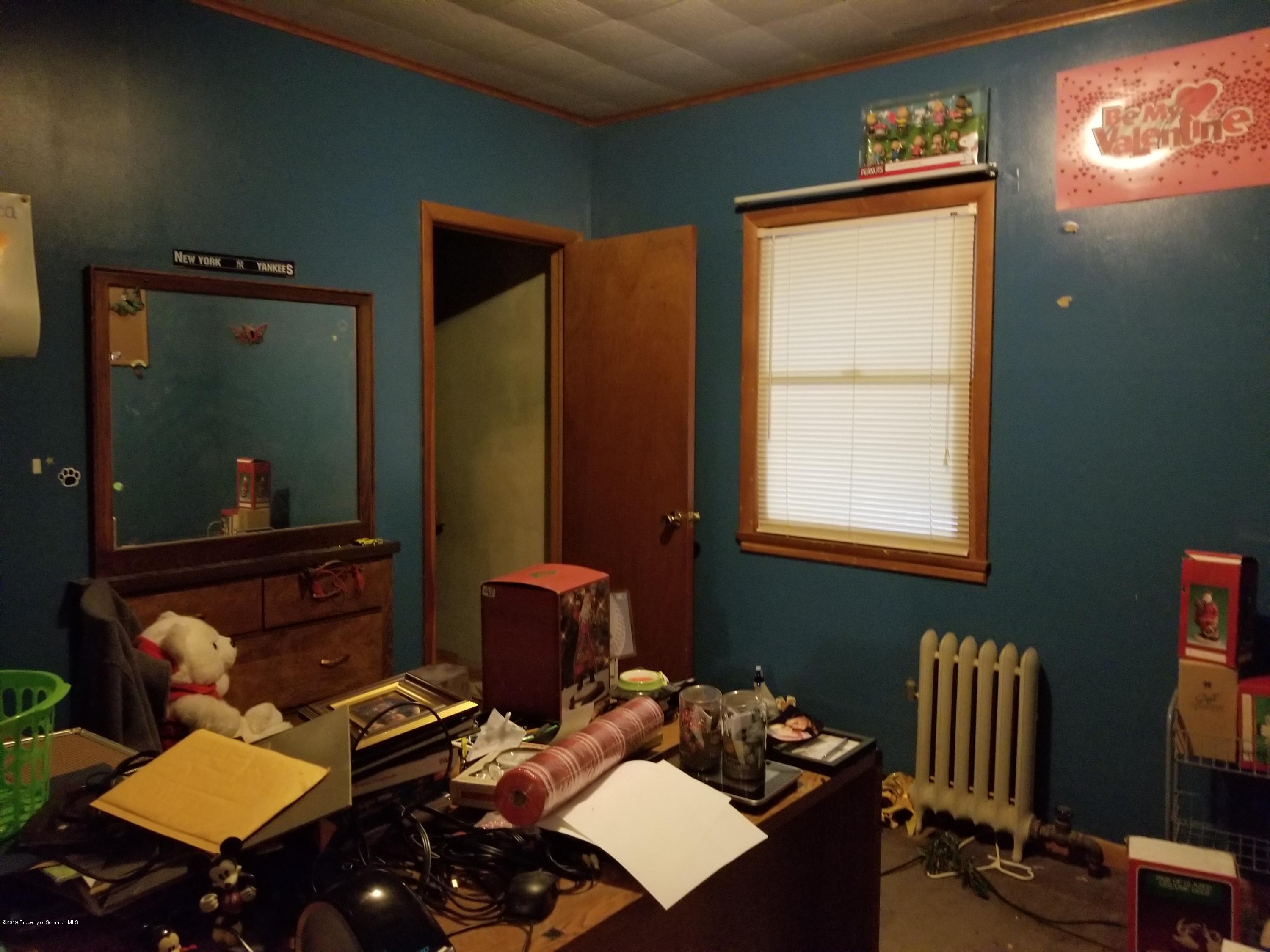 1719 Ash Street Scranton, PA 18510 - Photo 7 of 19 a room with furniture and a window