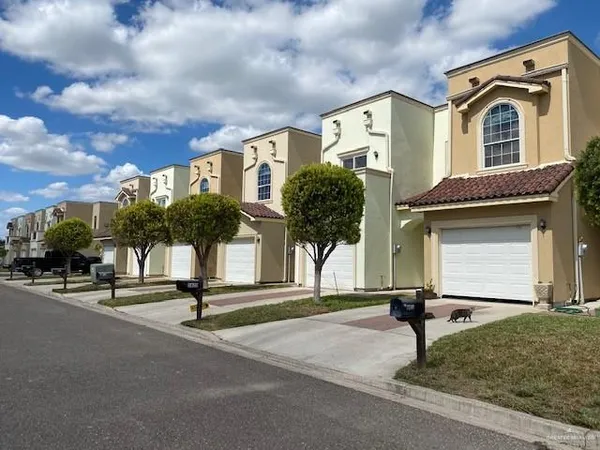 a front view of a house with a yard