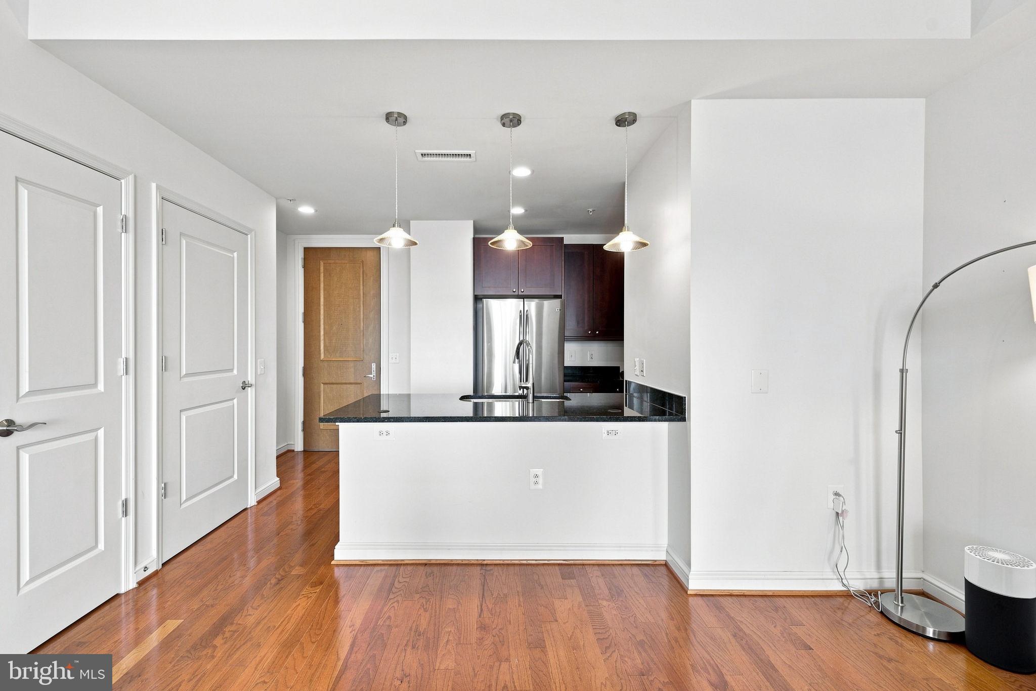 11990 Market Street, Unit 1514 Reston, VA 20190 - Photo 13 of 78 Kitchen opens to living area