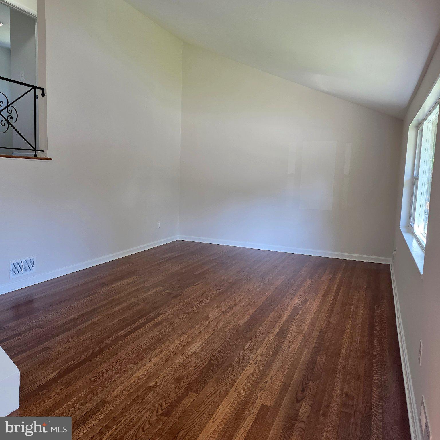 Sun filled Living Room with vaulted ceiling