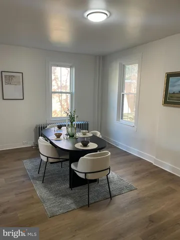 a view of a dining room with furniture and window