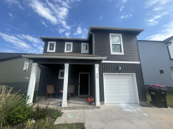a front view of a house with garage
