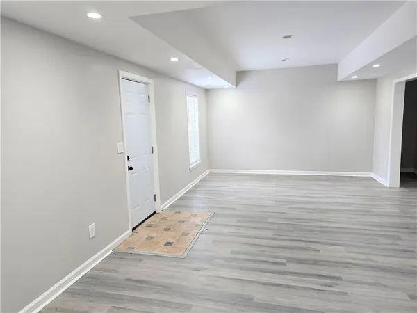 an empty room with wooden floor