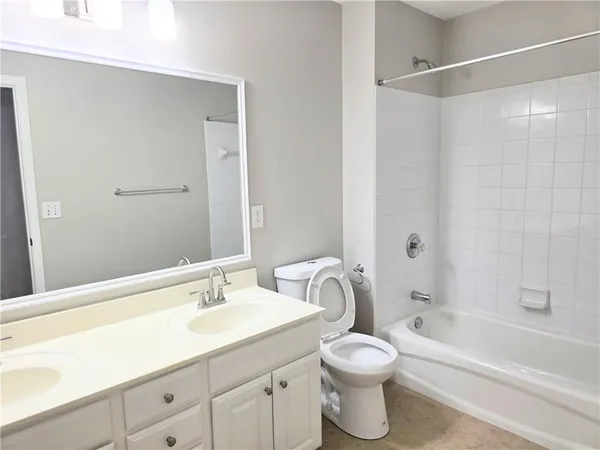 a bathroom with a sink a toilet and a bathtub