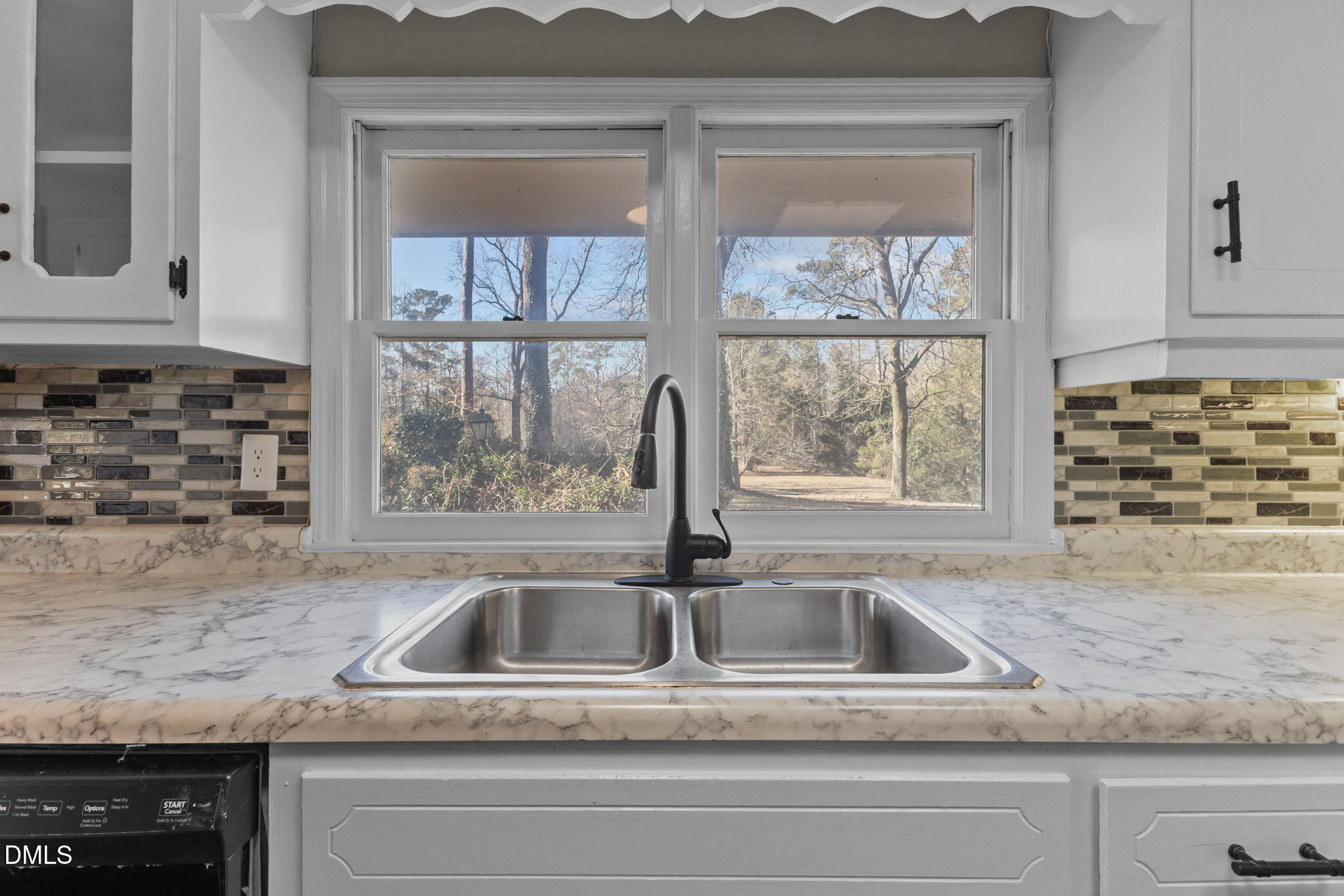 6522 Blake Street Stedman, NC 28391 - Photo 11 of 52 a kitchen with a sink and a window