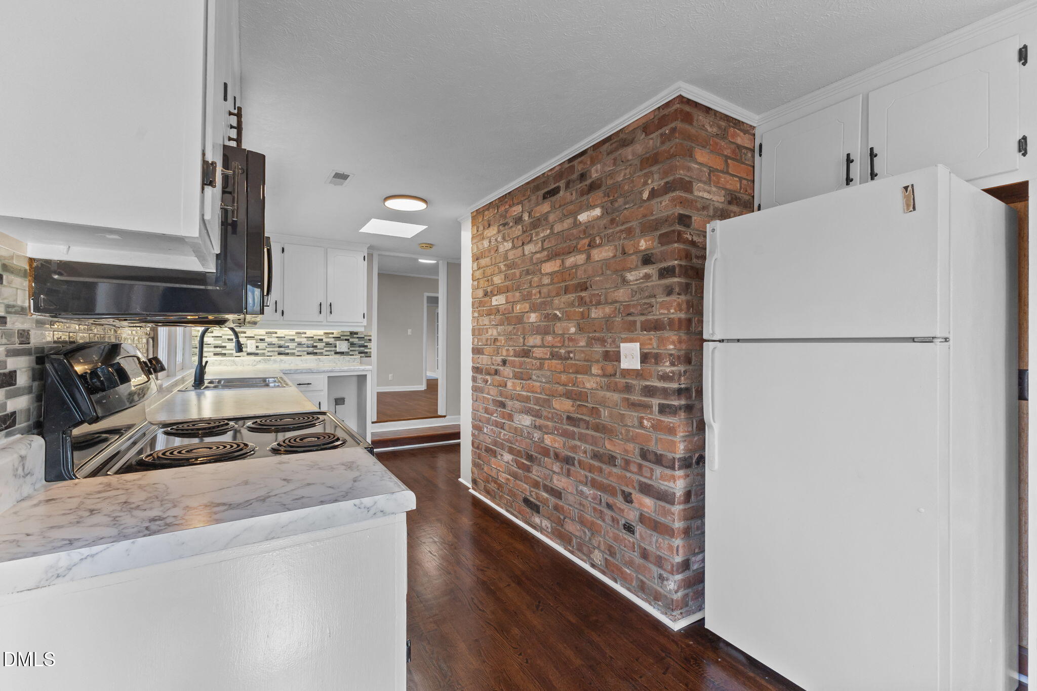 6522 Blake Street Stedman, NC 28391 - Photo 13 of 52 a kitchen with a refrigerator and a stove