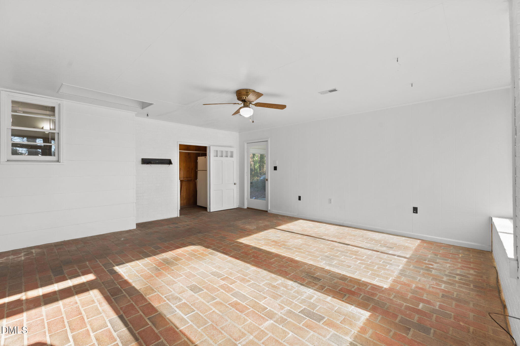 6522 Blake Street Stedman, NC 28391 - Photo 24 of 52 a view of a livingroom with wooden floor and a ceiling fan