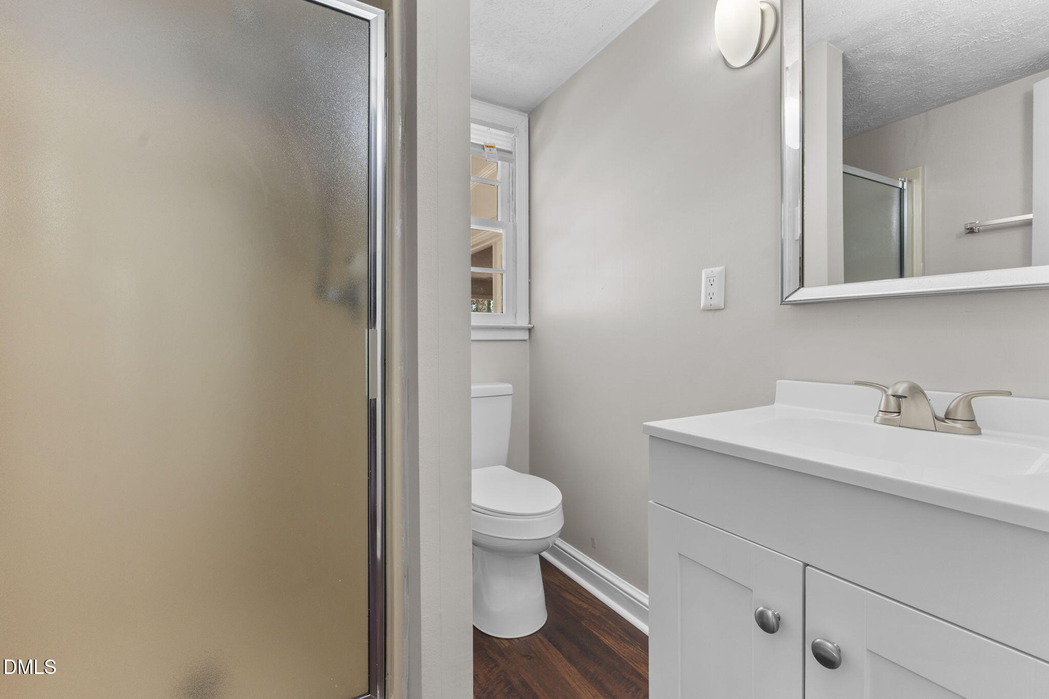 6522 Blake Street Stedman, NC 28391 - Photo 29 of 52 a bathroom with a granite countertop sink and a toilet