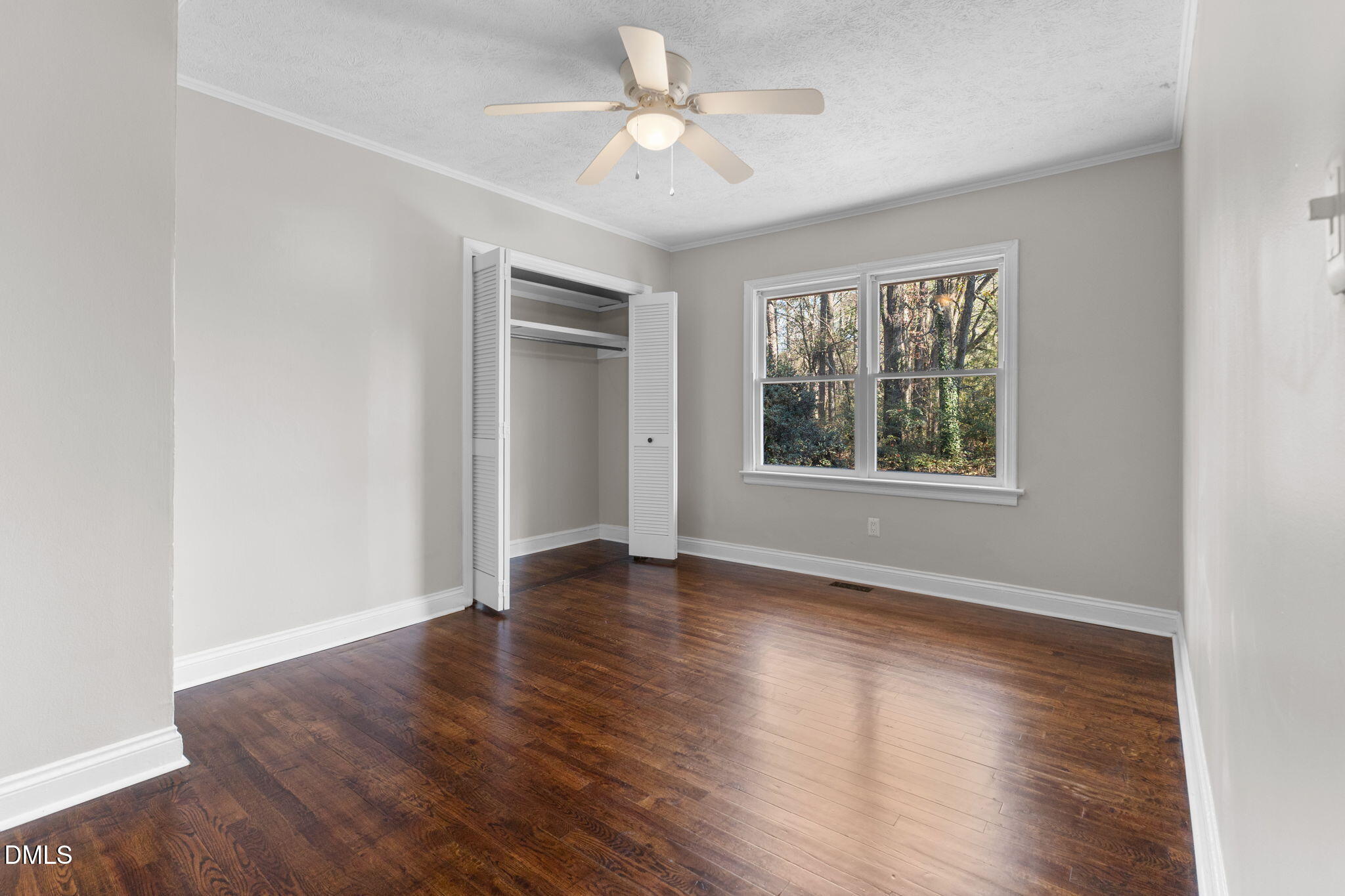 6522 Blake Street Stedman, NC 28391 - Photo 30 of 52 an empty room with wooden floor and windows