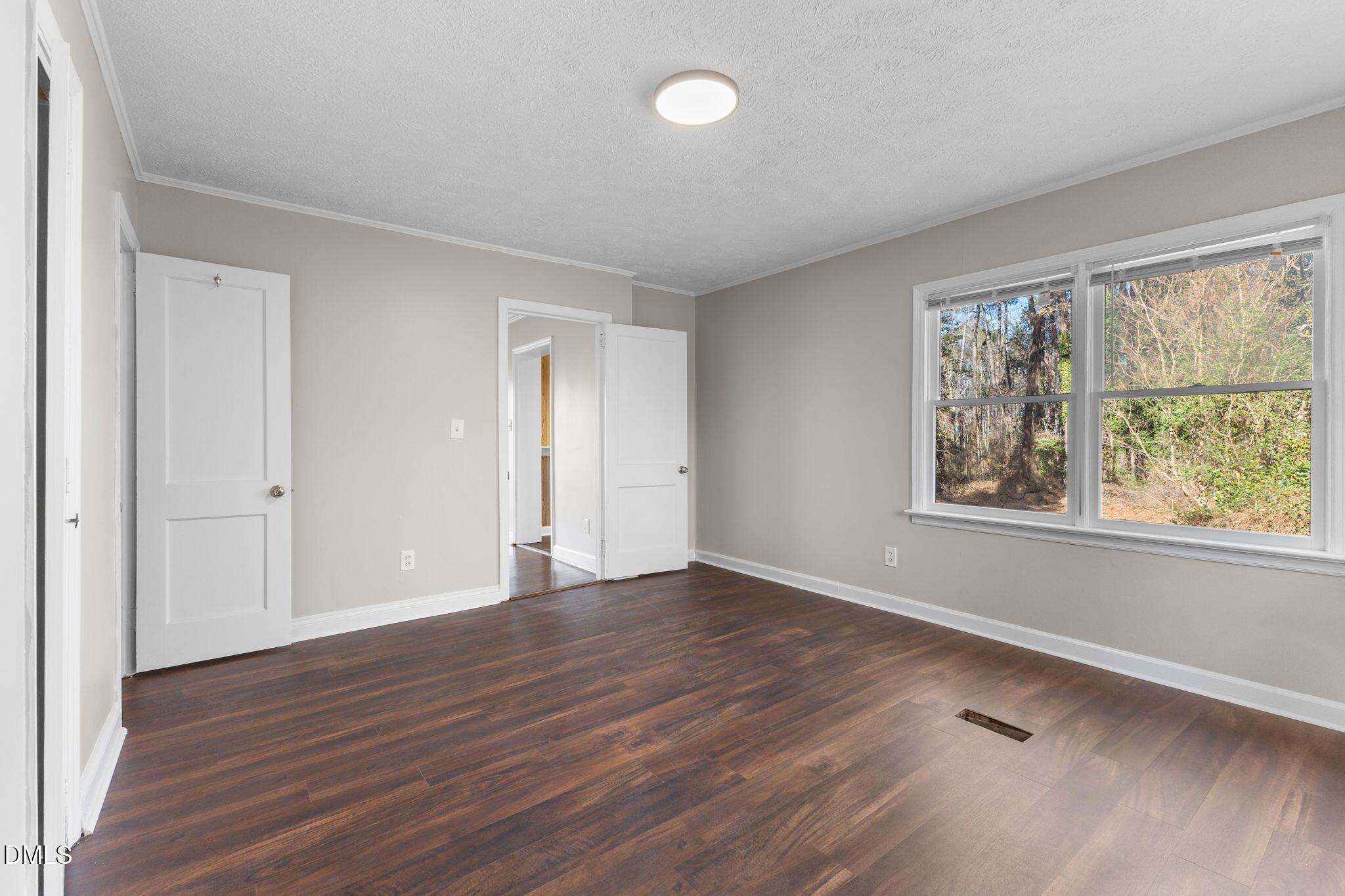 6522 Blake Street Stedman, NC 28391 - Photo 34 of 52 a view of an empty room with wooden floor and a window