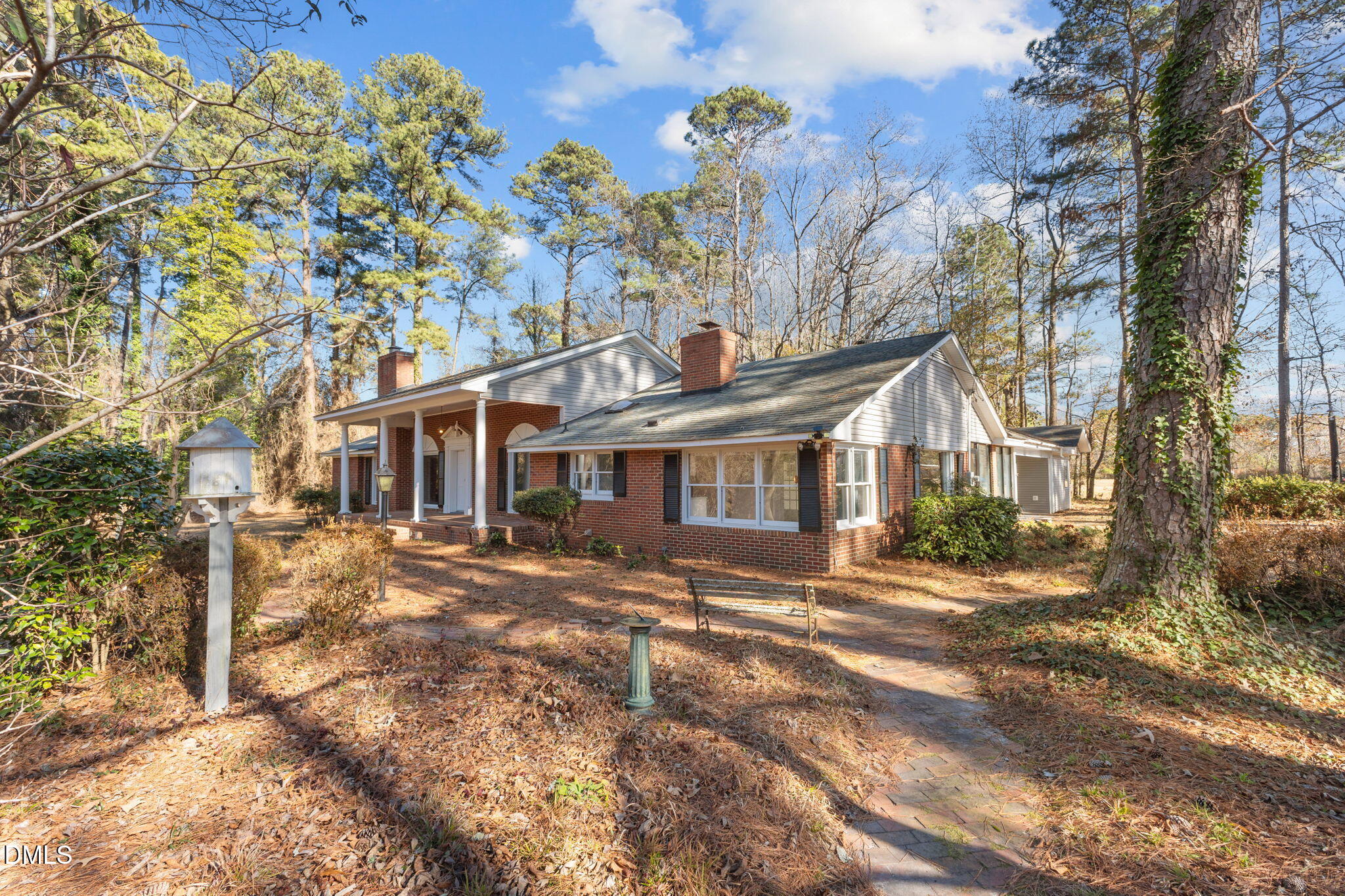 6522 Blake Street Stedman, NC 28391 - Photo 40 of 52 a front view of a house with a yard tree and outdoor seating