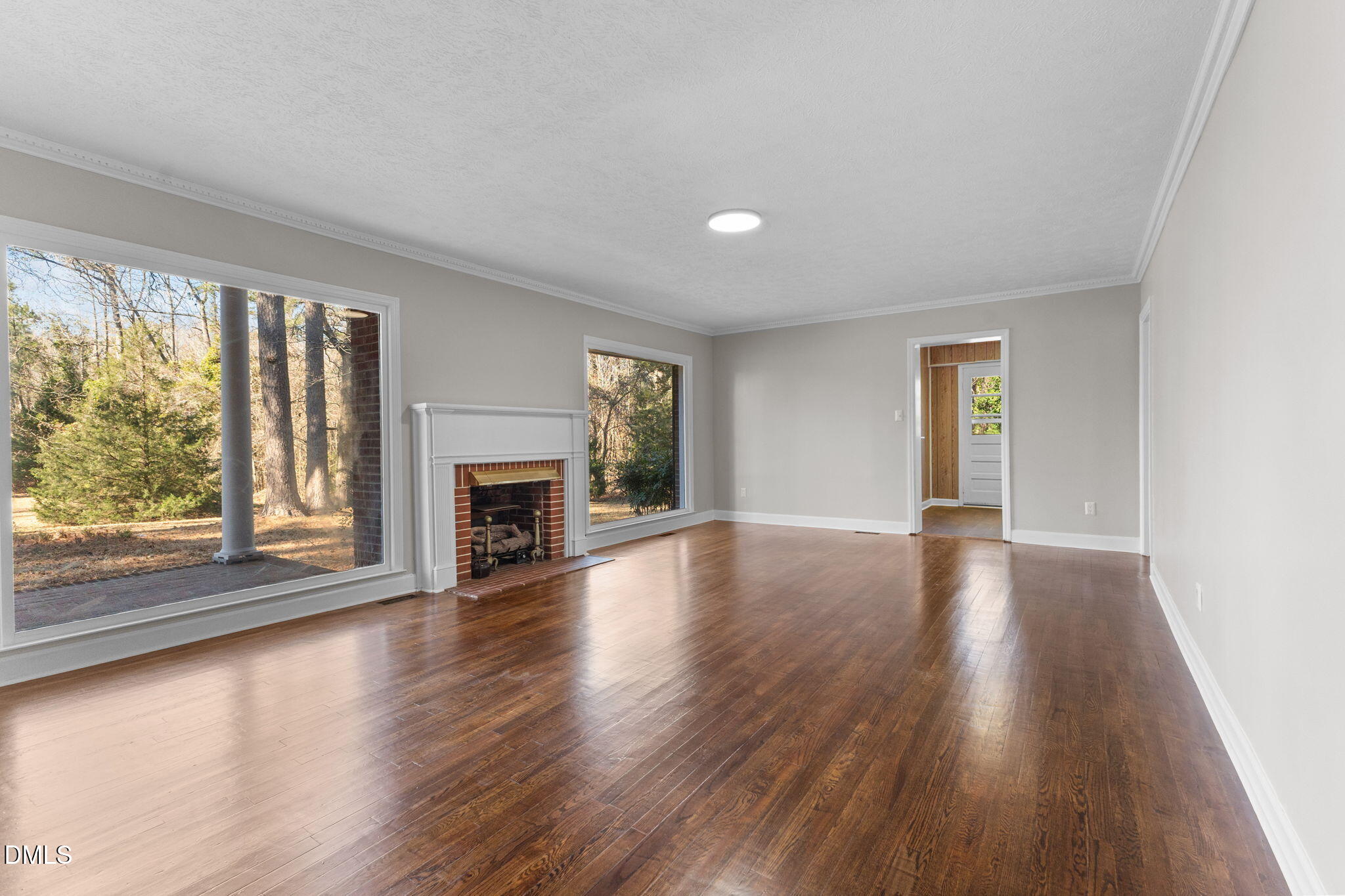 6522 Blake Street Stedman, NC 28391 - Photo 5 of 52 wooden floor fireplace and windows in an empty room