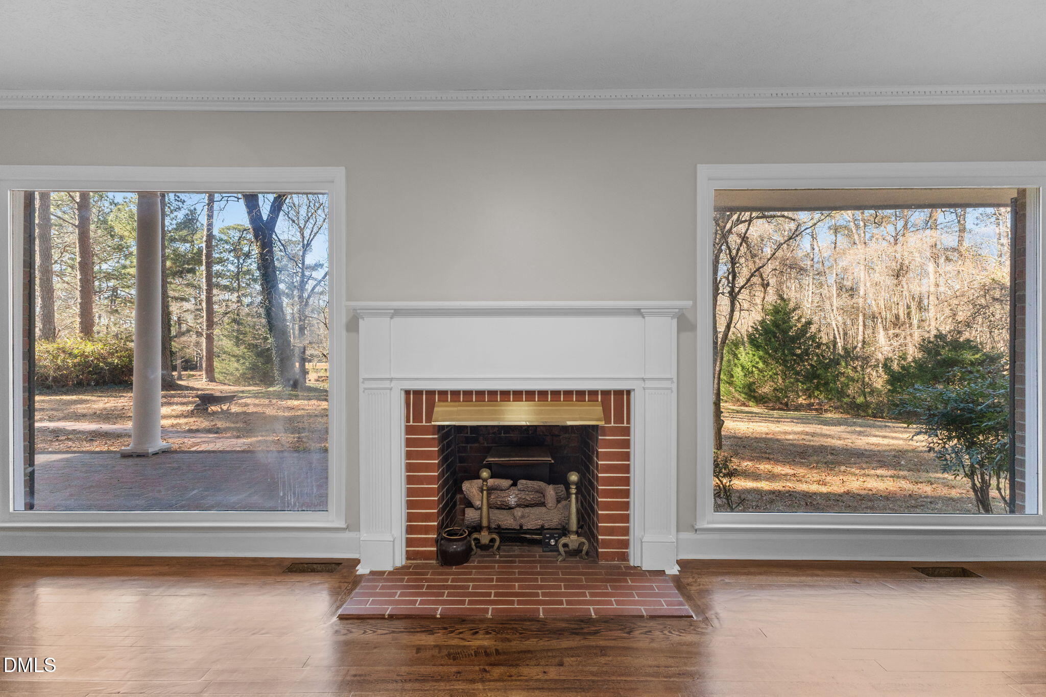 6522 Blake Street Stedman, NC 28391 - Photo 7 of 52 a living room with a fireplace and a floor to ceiling window
