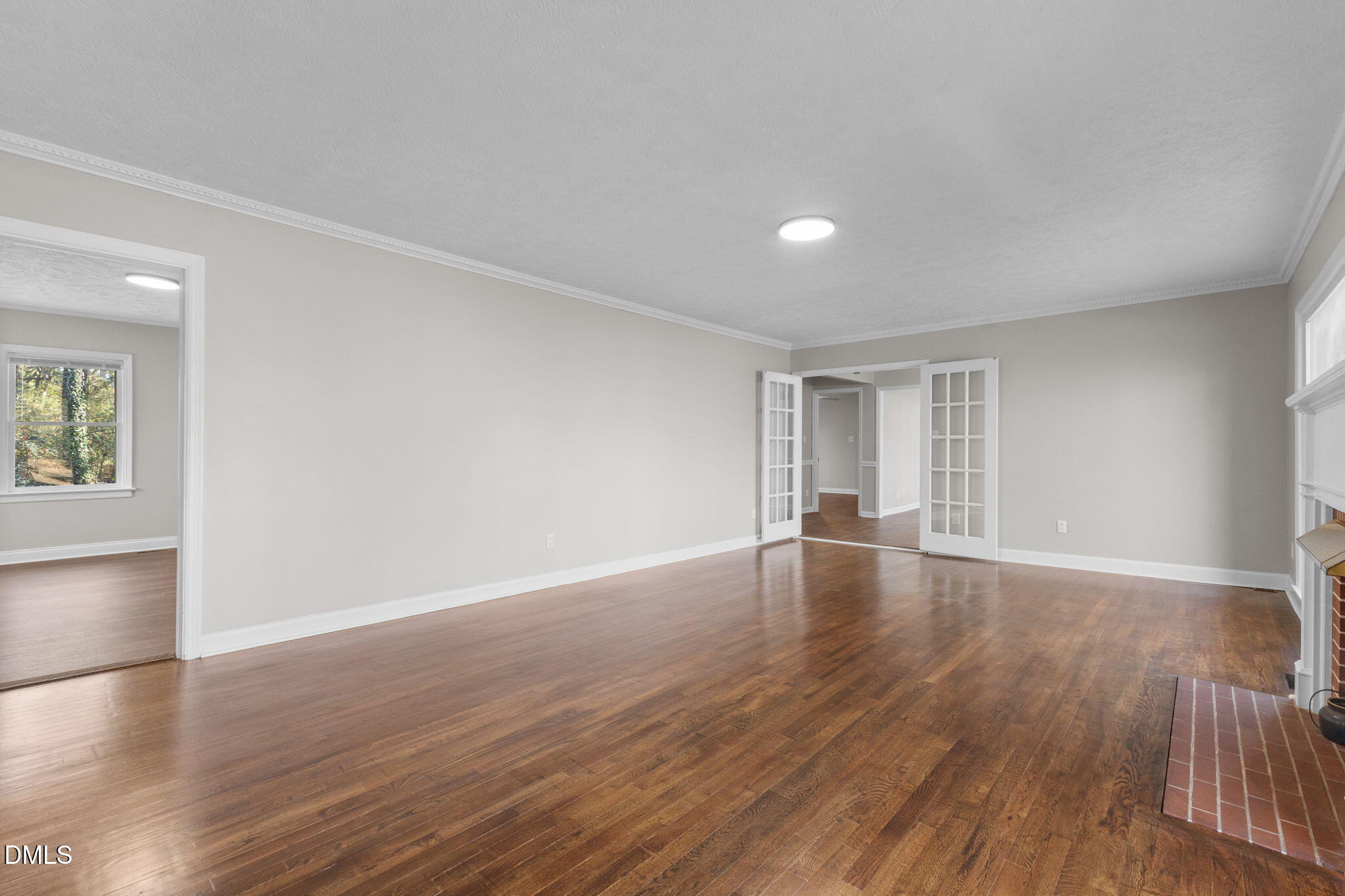 6522 Blake Street Stedman, NC 28391 - Photo 8 of 52 a view of empty room with wooden floor and fan