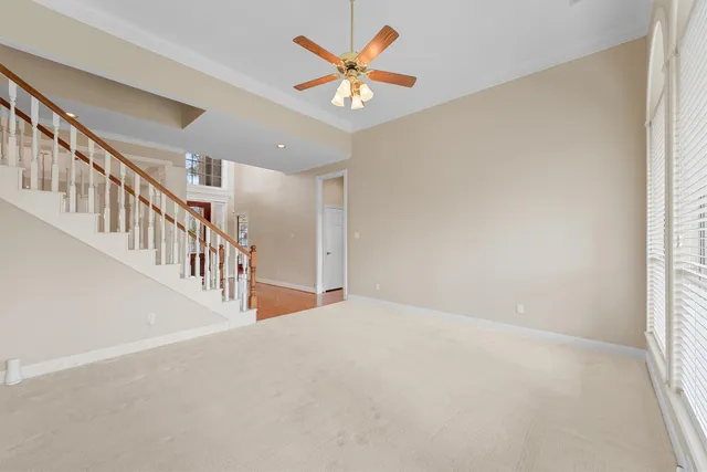 a spacious bathroom with a granite countertop sink a mirror and a bathtub