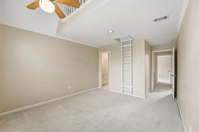 a view of a garden with a building in the background