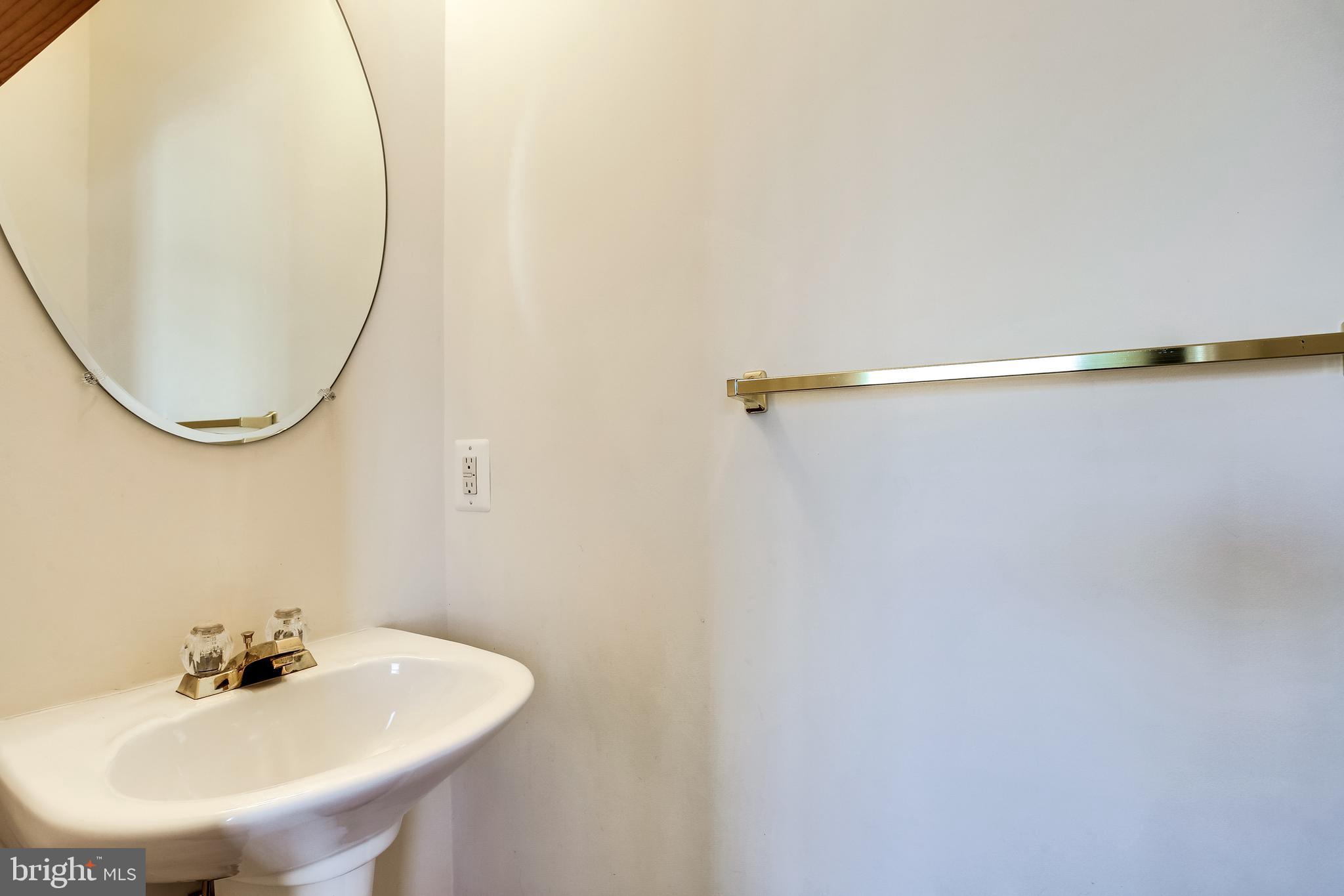 100 Penwick Circle Frederick, MD 21702 - Photo 11 of 18 a bathroom with a sink and a mirror