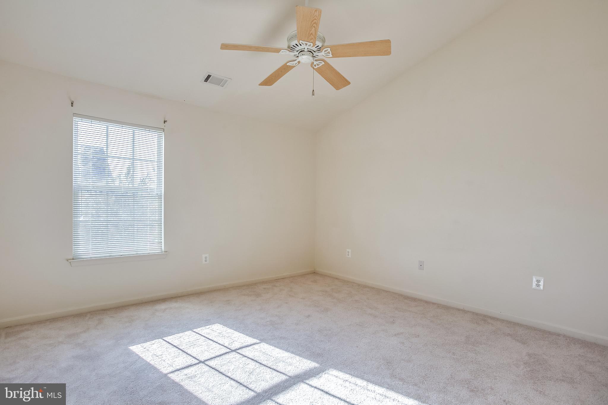 100 Penwick Circle Frederick, MD 21702 - Photo 6 of 18 an empty room with windows and fan