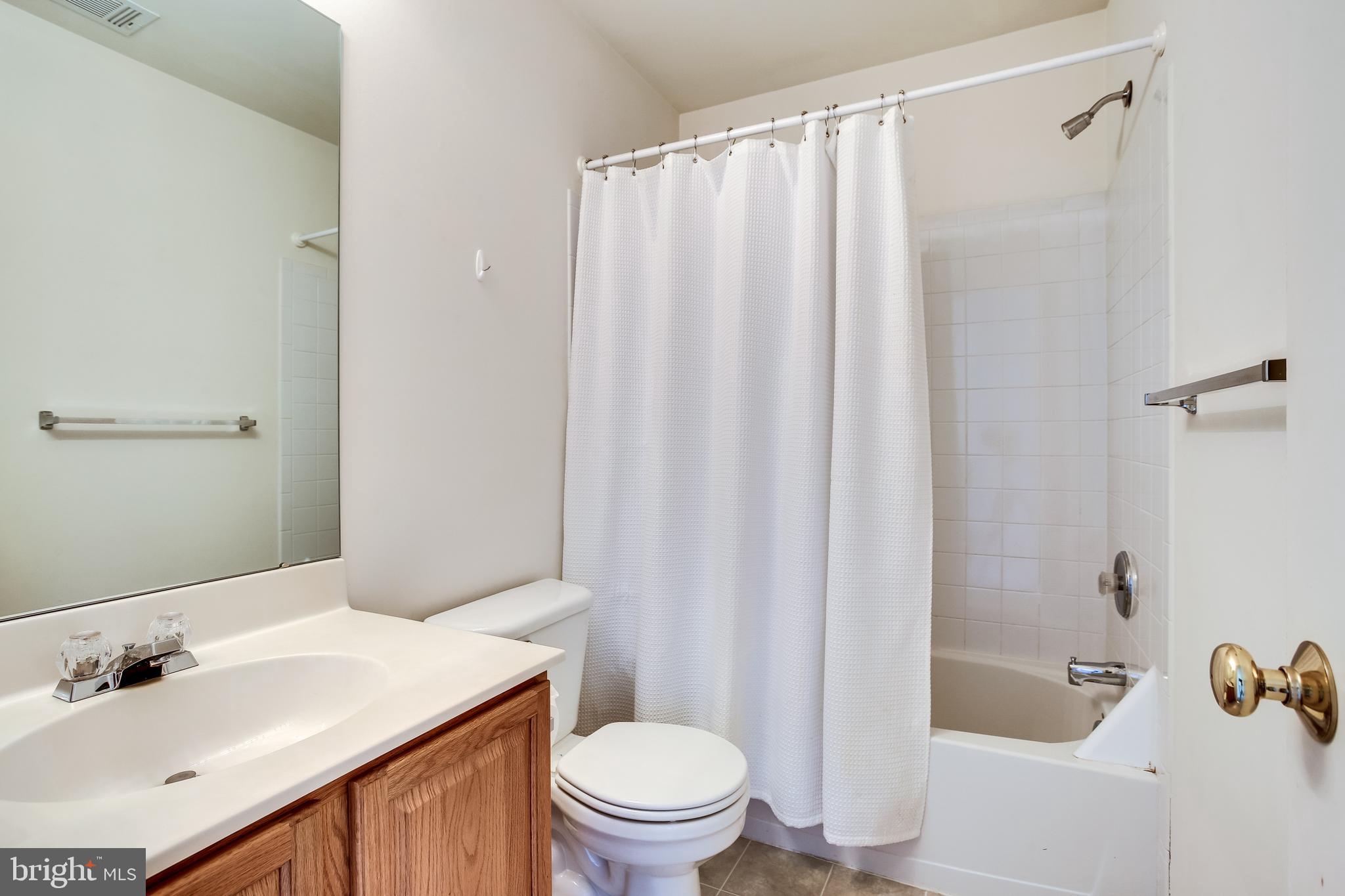 100 Penwick Circle Frederick, MD 21702 - Photo 8 of 18 a bathroom with a sink toilet and shower