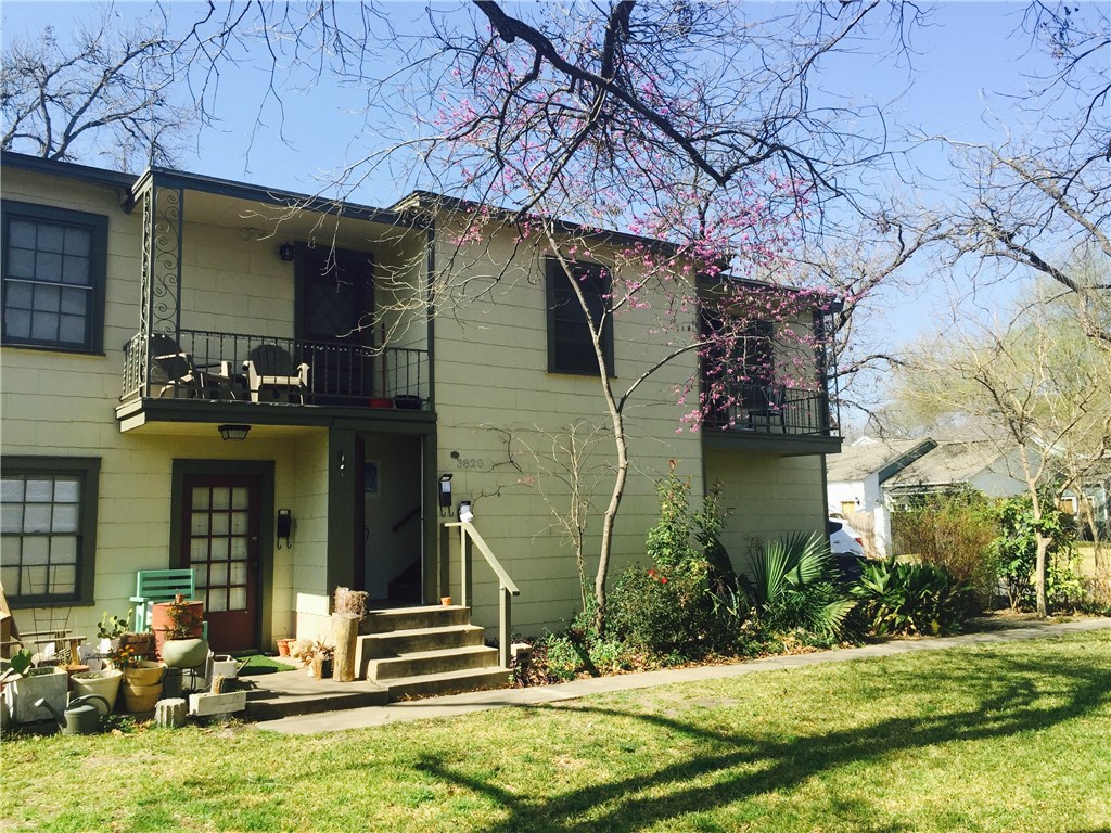 3820 Duval Street, Unit D Austin, TX 78751 - Photo 1 of 1 a front view of a house with a yard