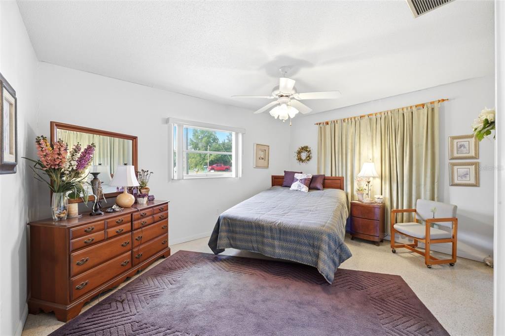 1830 South Mandarin Terrace Inverness, FL 34450 - Photo 18 of 47 a bedroom with a bed and wooden floor