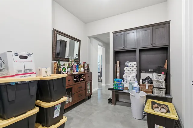 a living room with a couch and a dining table