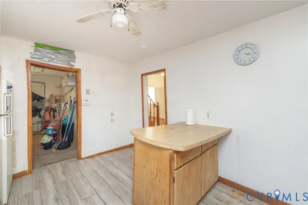 a view of livingroom with hallway and wooden floor