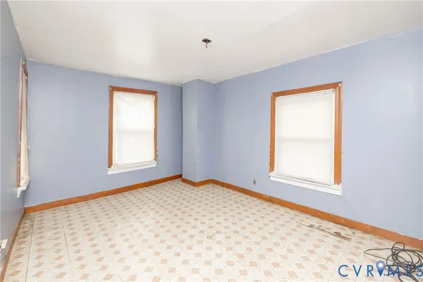 an empty room with windows