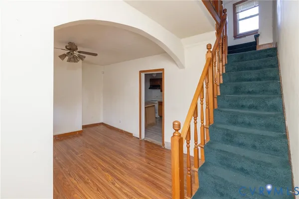 a view of an entryway with wooden floor