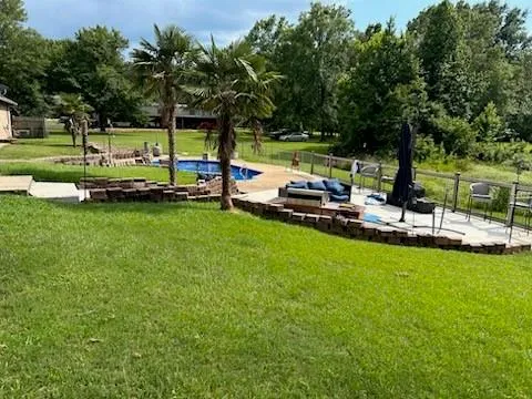 a view of a swimming pool with a table and chairs