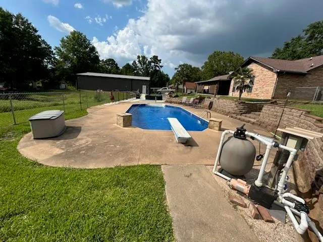 a view of a swimming pool with lounge chair
