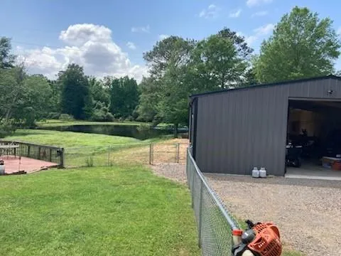a view of a backyard with sitting area
