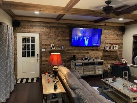 a room with furniture and a flat screen tv