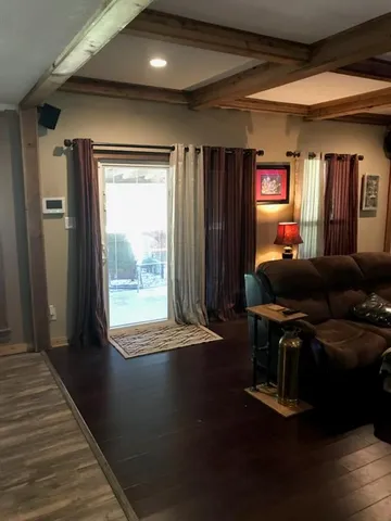 a room with furniture and wooden floor