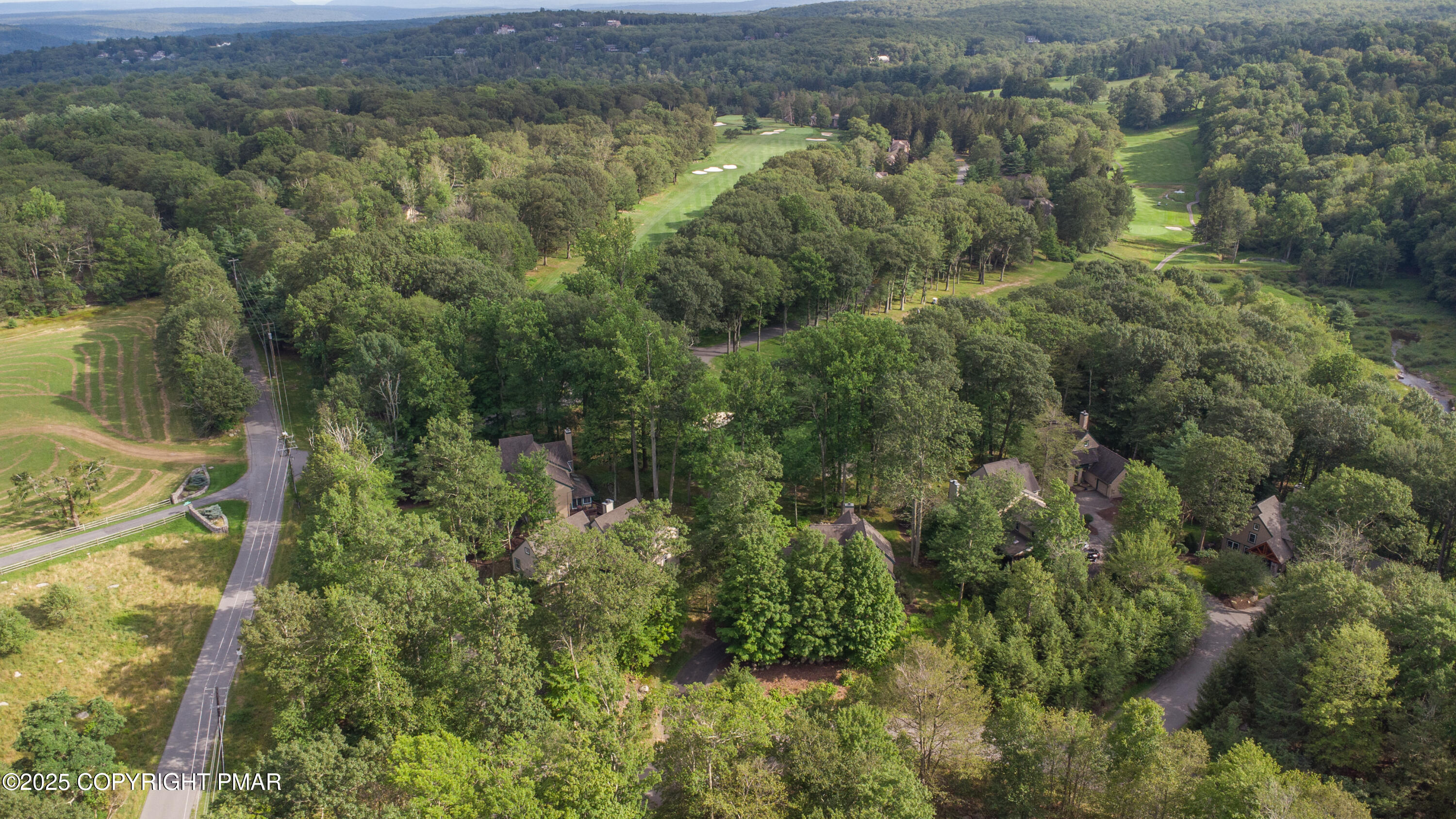 Creekside Road Canadensis, PA 18325 - Photo 12 of 22 an aerial view of residential houses with outdoor space and trees