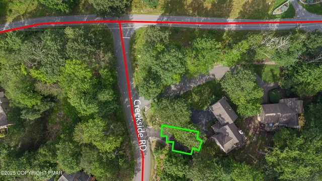 a view of a lush green hillside and houses