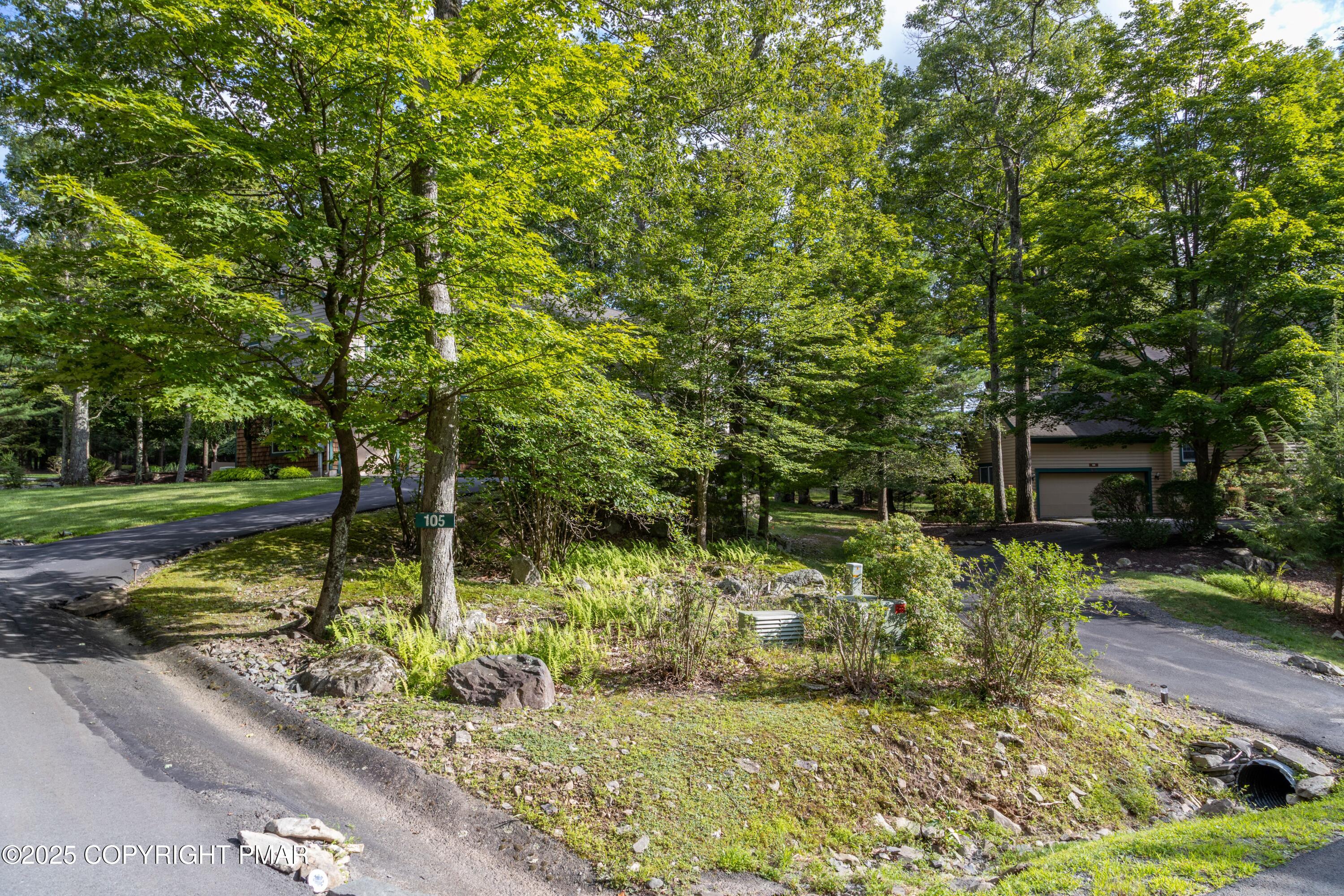Creekside Road Canadensis, PA 18325 - Photo 7 of 22 a view of a garden with a bench