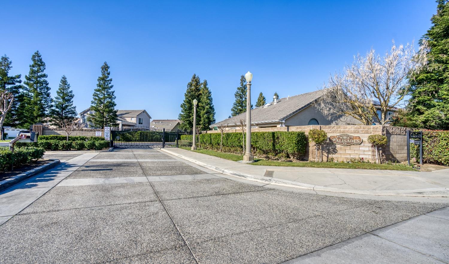 1950 Lawrence Avenue Clovis, CA 93611 - Photo 21 of 23 a view of a house with a yard and potted plants