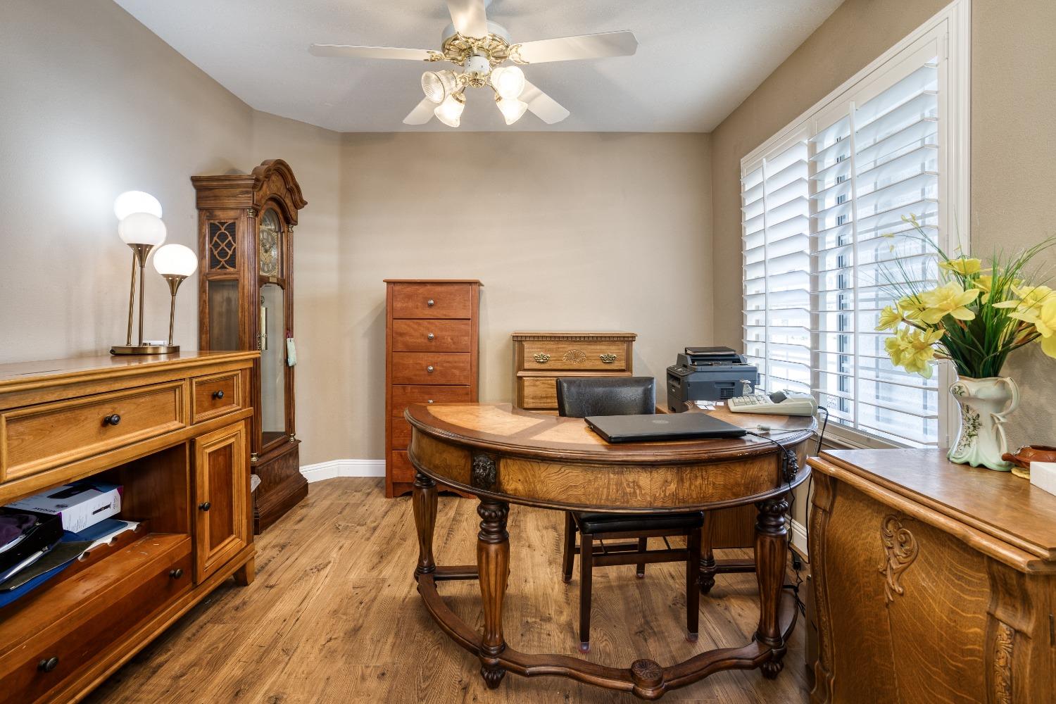 1950 Lawrence Avenue Clovis, CA 93611 - Photo 8 of 23 a view of a dining room with furniture window and wooden floor