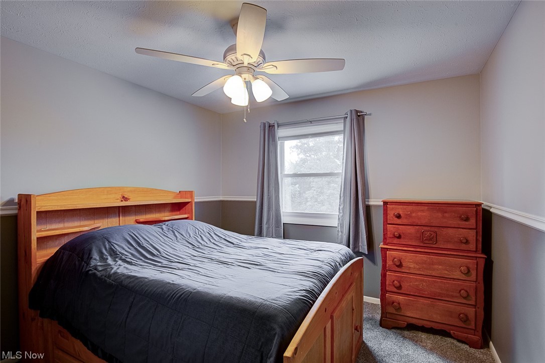 31950 Cannon Road Solon, OH 44139 - Photo 21 of 33 Carpeted bedroom with ceiling fan