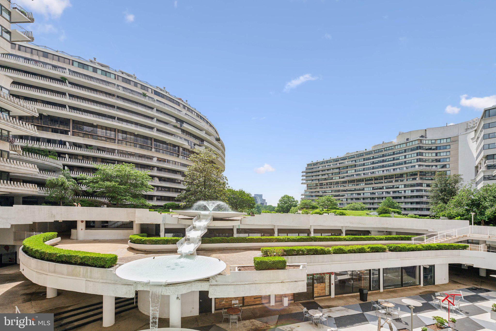 2510 Virginia Avenue Northwest, Unit 2BN Washington, DC 20037 - Photo 21 of 21 a view of a tall building with a table and chairs